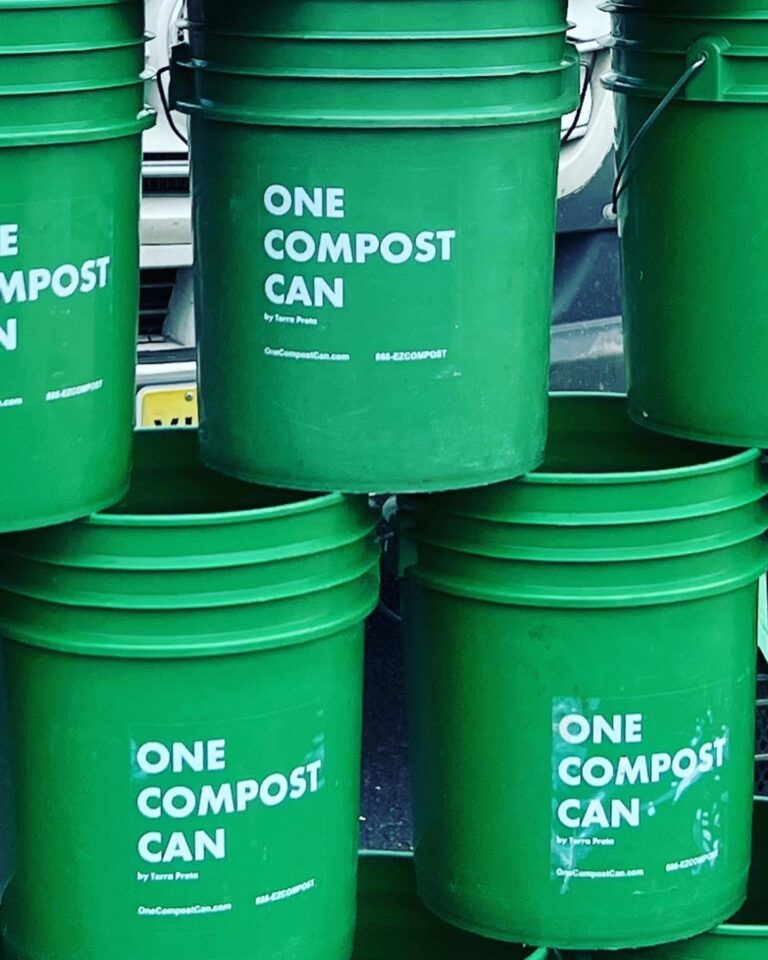 Green plastic compost buckets with One Compost Can in white on the side